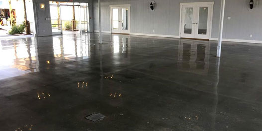 This image shows a commercial space with a metallic epoxy floor.