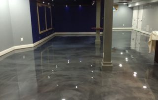 This image shows a commercial space with a metallic epoxy floor.