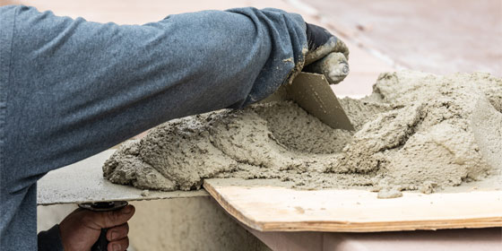 This image shows a man preparing cement.