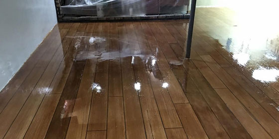This image shows a floor that has a wood Stamped Concrete Flooring.