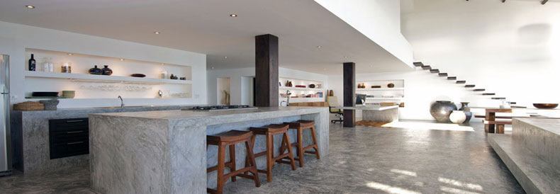 This image shows a living room with a polished concrete