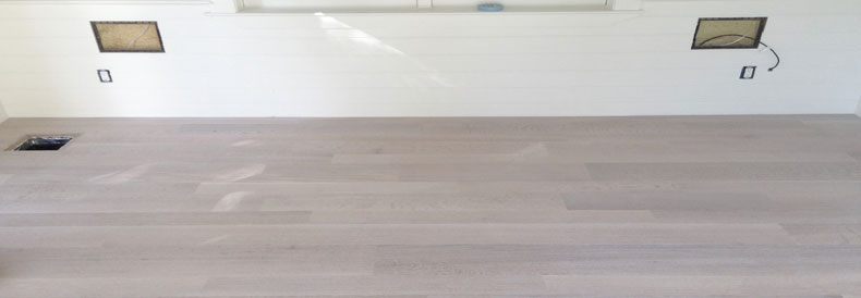 This image shows White Washed Hardwood Flooring