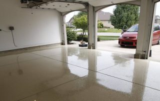 This image shows a garage floor with flake epoxy painted floor.