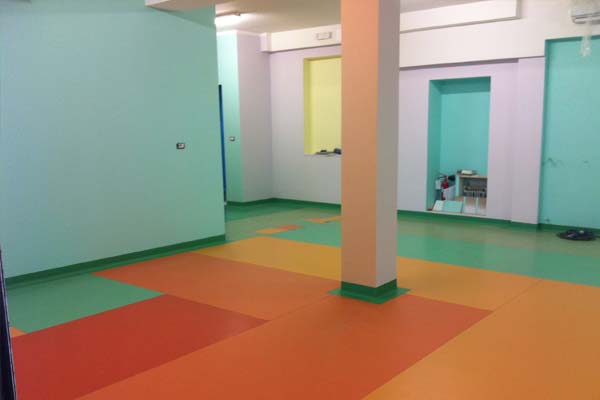 This image shows a gym floor with rubber floor.